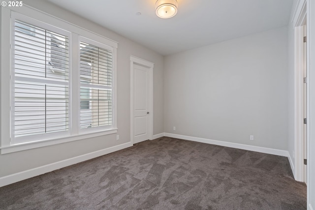 1825 NW Tanner Ct, Camas, WA 98607 - unfurnished bedroom with dark carpet and baseboards