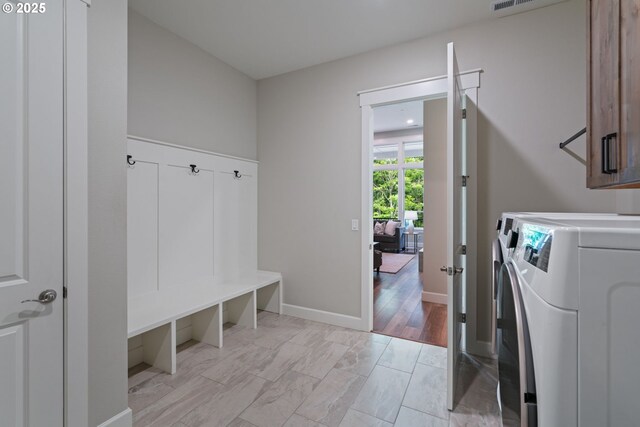 1825 NW Tanner Ct, Camas, WA 98607 - laundry room with cabinet space, independent washer and dryer, and baseboards