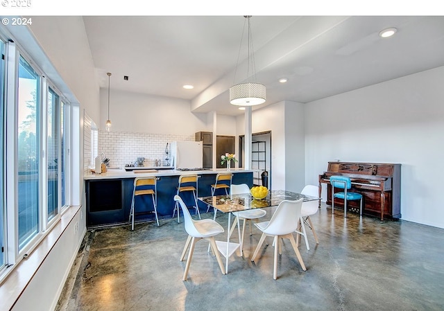 12508 NW Mountain View Rd, Portland, OR 97231 - dining room with recessed lighting, baseboards, and concrete floors