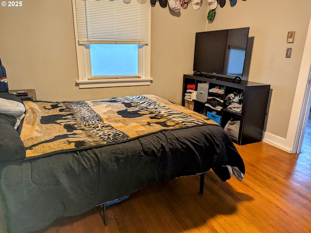 bedroom featuring wood-type flooring