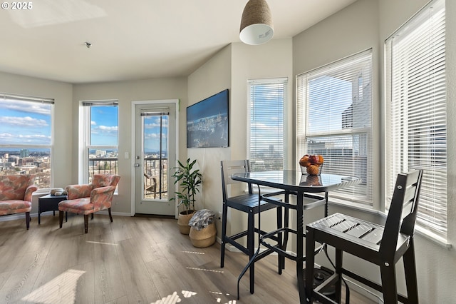 410 NW Uptown Ter Unit 3-B, Portland, OR 97210 - dining space featuring wood finished floors and plenty of natural light
