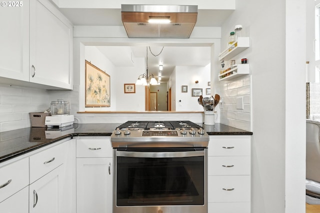 2024 SW Howards Way, Portland, OR 97201 - kitchen featuring stainless steel gas range oven, tasteful backsplash, white cabinets, a chandelier, and dark stone counters