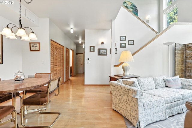2024 SW Howards Way, Portland, OR 97201 - living area featuring a chandelier and light wood-type flooring