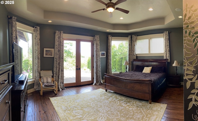 625 St Andrews Loop, Creswell, OR 97426 - bedroom featuring multiple windows, access to exterior, a tray ceiling, dark wood-type flooring, and recessed lighting