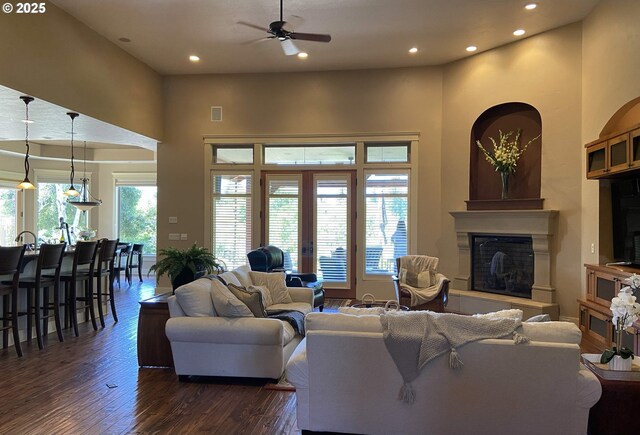 625 St Andrews Loop, Creswell, OR 97426 - living room with dark wood finished floors, ceiling fan, recessed lighting, a glass covered fireplace, and a high ceiling