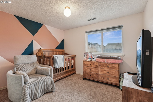 carpeted bedroom with a textured ceiling