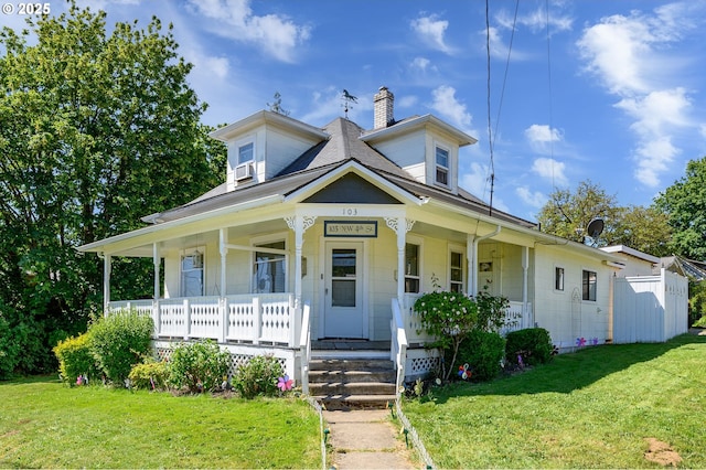 103 NW 4th St, Willamina, OR 97396 - view of front facade with a porch, a chimney, and a front yard