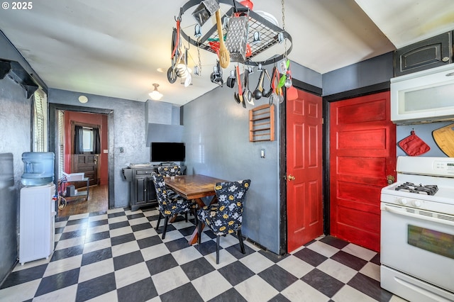 103 NW 4th St, Willamina, OR 97396 - kitchen with white appliances and dark floors