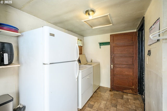 103 NW 4th St, Willamina, OR 97396 - laundry room featuring attic access, washing machine and dryer, and stone finish floors