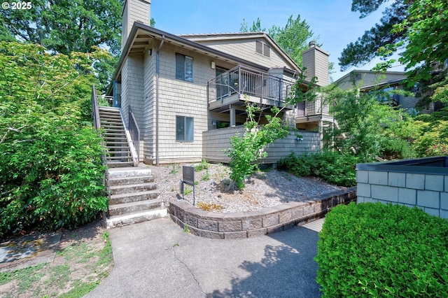 56 Galen St, Lake Oswego, OR 97035 - rear view of house with stairs and a chimney