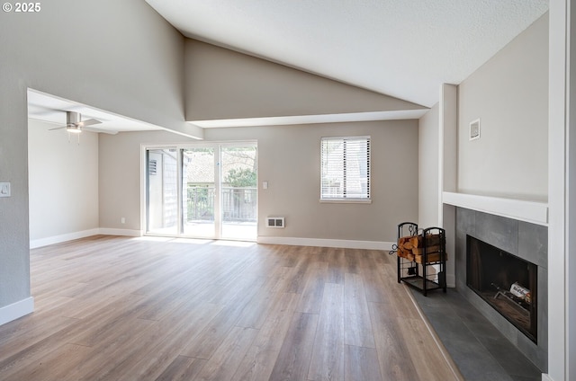56 Galen St, Lake Oswego, OR 97035 - unfurnished living room featuring a fireplace, wood finished floors, vaulted ceiling, baseboards, and a ceiling fan