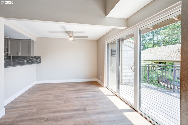 56 Galen St, Lake Oswego, OR 97035 - unfurnished dining area featuring ceiling fan, light wood finished floors, and baseboards
