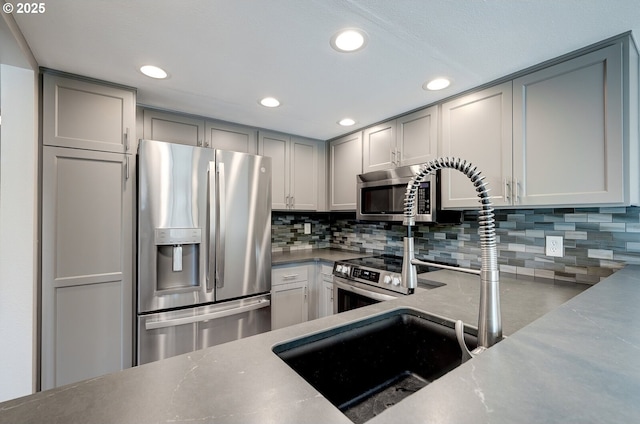 56 Galen St, Lake Oswego, OR 97035 - kitchen with stainless steel appliances, gray cabinets, tasteful backsplash, and recessed lighting