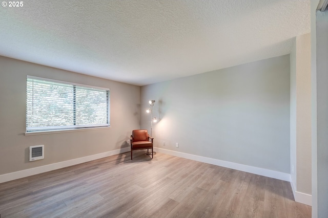 56 Galen St, Lake Oswego, OR 97035 - unfurnished room featuring wood finished floors, a textured ceiling, and baseboards