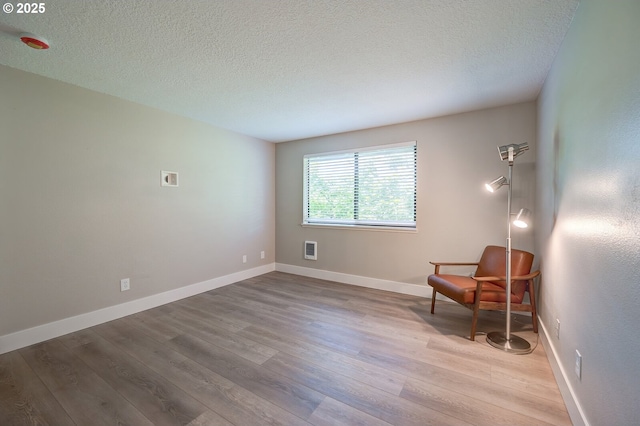 56 Galen St, Lake Oswego, OR 97035 - unfurnished room featuring wood finished floors, a textured ceiling, and baseboards