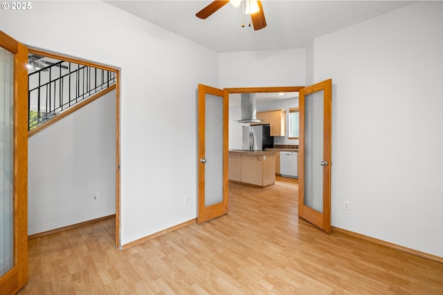 651 NE Anderson Rd, Gresham, OR 97030 - unfurnished room featuring light wood-type flooring, a ceiling fan, and stairs