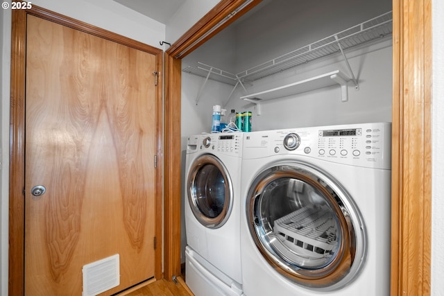 651 NE Anderson Rd, Gresham, OR 97030 - laundry room with washer and dryer and light wood-style flooring