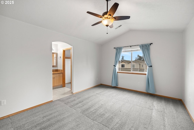 651 NE Anderson Rd, Gresham, OR 97030 - unfurnished room with arched walkways, lofted ceiling, a ceiling fan, and light colored carpet
