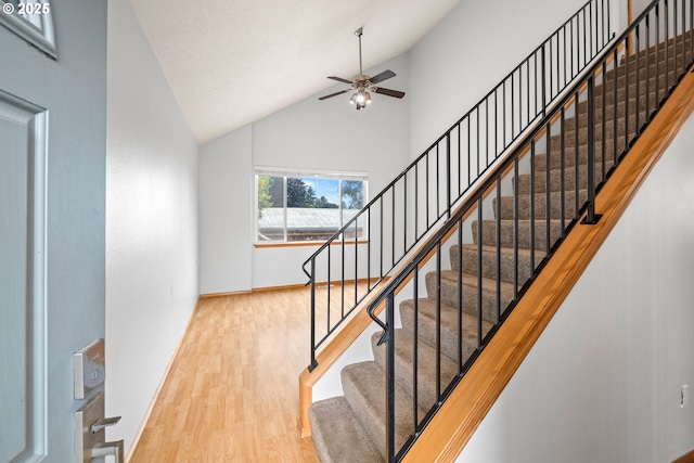 651 NE Anderson Rd, Gresham, OR 97030 - stairs featuring wood finished floors, a ceiling fan, and high vaulted ceiling