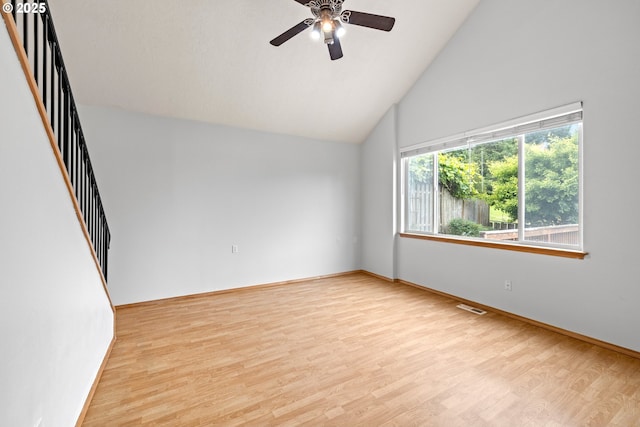651 NE Anderson Rd, Gresham, OR 97030 - unfurnished room with light wood-style flooring, a ceiling fan, high vaulted ceiling, and stairs