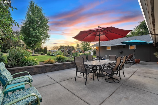 34926 SW Johnson School Rd, Cornelius, OR 97113 - patio terrace at dusk with outdoor dining space, a patio area, and a yard