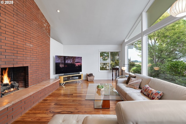 34926 SW Johnson School Rd, Cornelius, OR 97113 - living room featuring high vaulted ceiling, a brick fireplace, and wood finished floors
