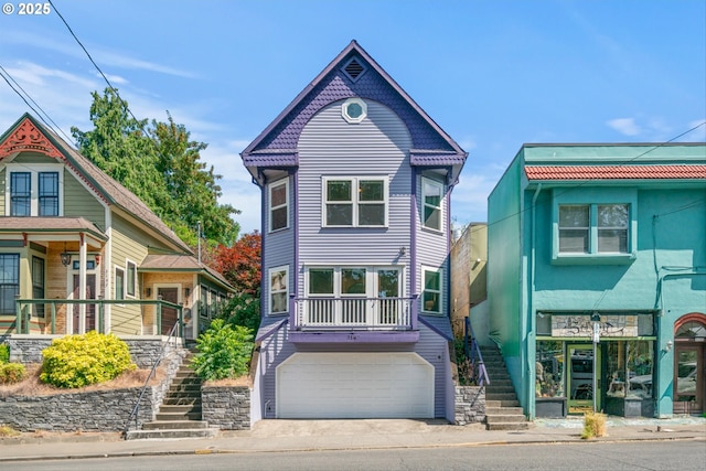 3147 SE Belmont St, Portland, OR 97214 - victorian house featuring stairs, an attached garage, and concrete driveway