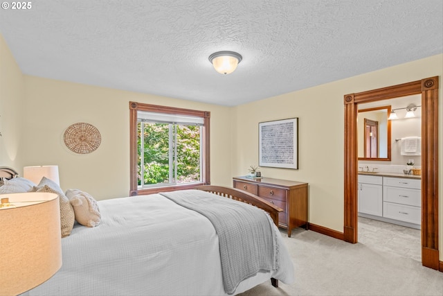 3147 SE Belmont St, Portland, OR 97214 - bedroom featuring light carpet, ensuite bath, and a textured ceiling