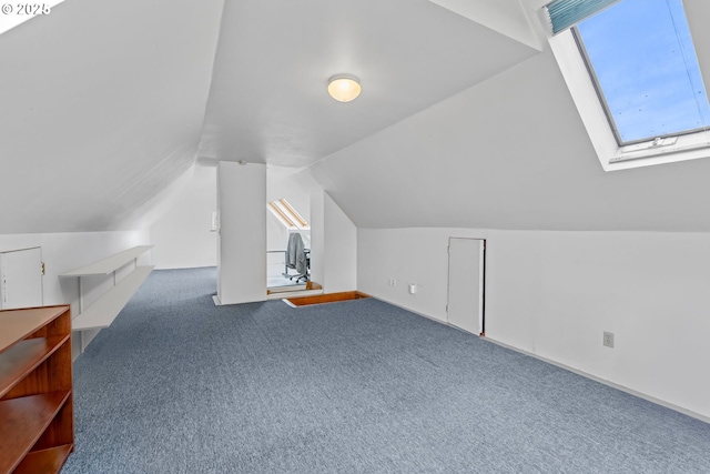 3147 SE Belmont St, Portland, OR 97214 - bonus room featuring carpet, a skylight, vaulted ceiling, and healthy amount of natural light
