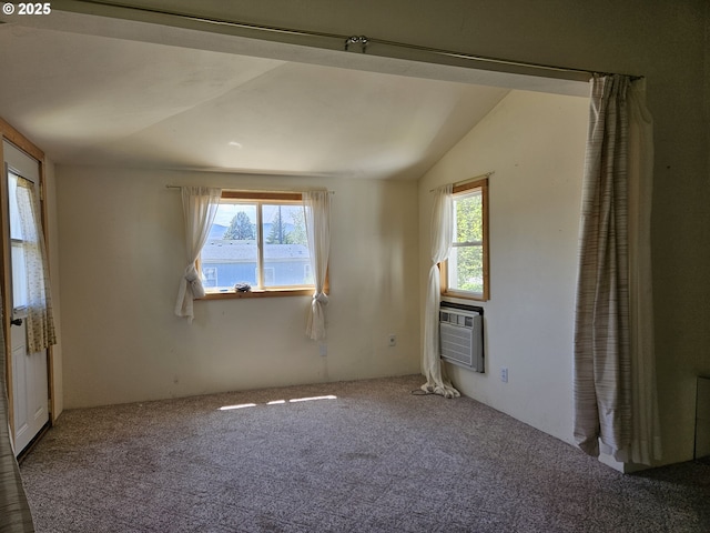 333 3rd St, Richland, OR 97870 - empty room featuring plenty of natural light, carpet, vaulted ceiling, and a wall mounted AC
