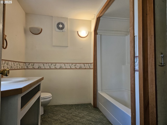 333 3rd St, Richland, OR 97870 - bathroom with toilet, vanity, wainscoting, and tile walls