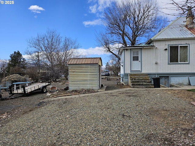 333 3rd St, Richland, OR 97870 - view of property exterior with metal roof, a storage unit, and an outdoor structure