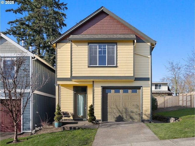 view of front property with a garage and a front yard