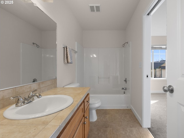 full bathroom with vanity, shower / bathing tub combination, decorative backsplash, and toilet