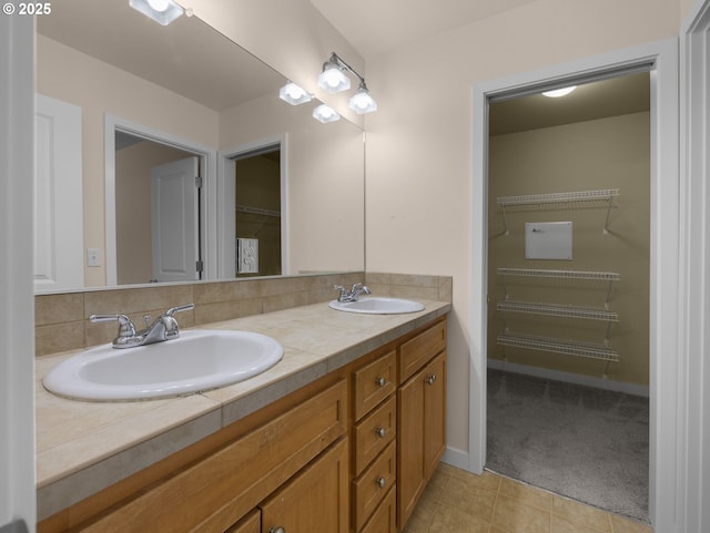 bathroom featuring tasteful backsplash and vanity