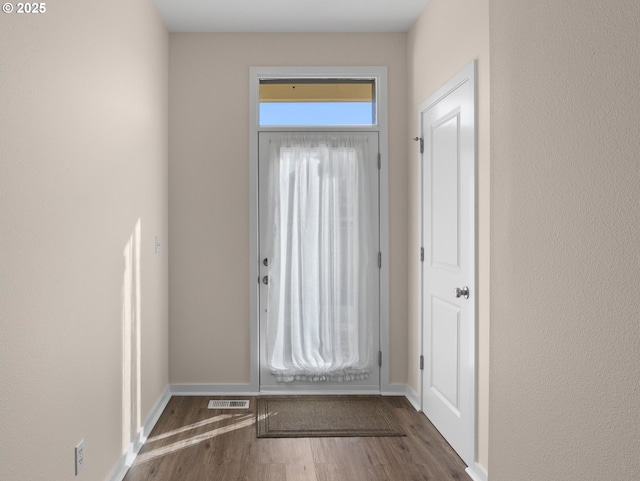 doorway to outside with dark hardwood / wood-style flooring