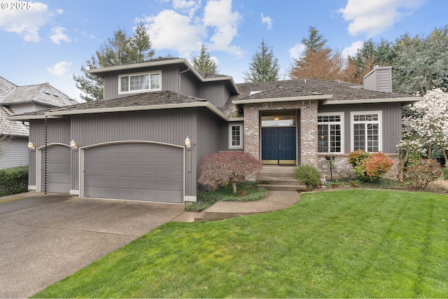view of front of property featuring concrete driveway, a front lawn, a chimney, and an attached garage