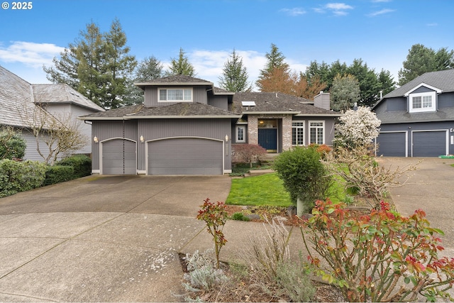 view of front facade featuring concrete driveway and an attached garage
