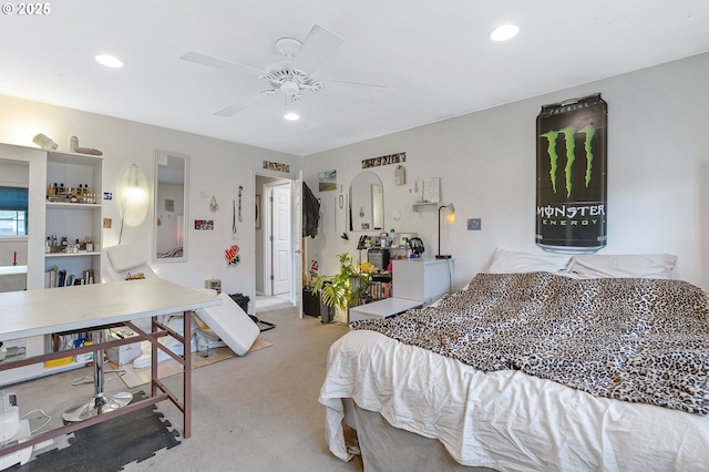 bedroom with recessed lighting, light colored carpet, and a ceiling fan