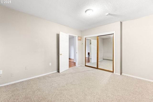 9304 NE 96th St, Vancouver, WA 98662 - unfurnished bedroom featuring carpet floors, a textured ceiling, and a closet