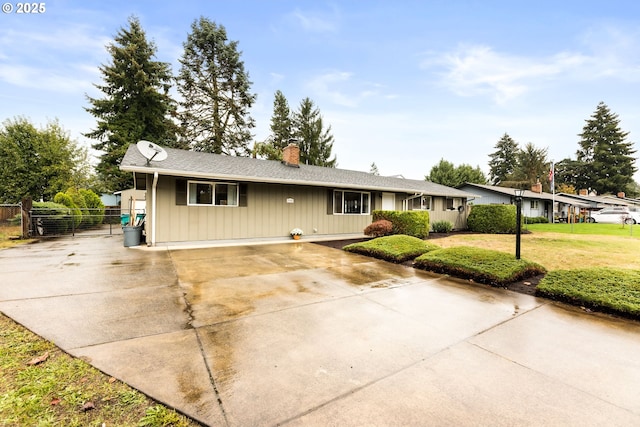 9304 NE 96th St, Vancouver, WA 98662 - ranch-style house with a chimney, driveway, and board and batten siding