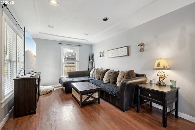 living room featuring dark hardwood / wood-style floors