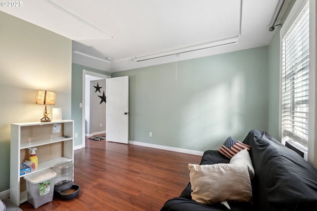 living area with dark hardwood / wood-style floors