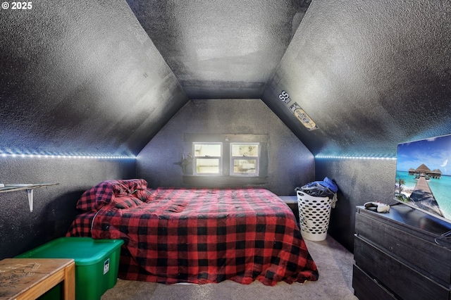 carpeted bedroom featuring vaulted ceiling