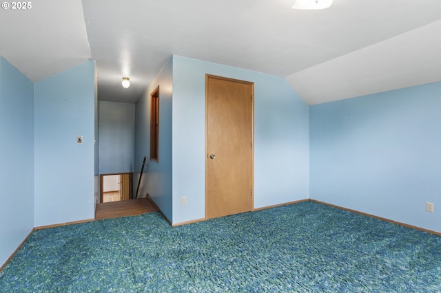bonus room featuring carpet, baseboards, and lofted ceiling