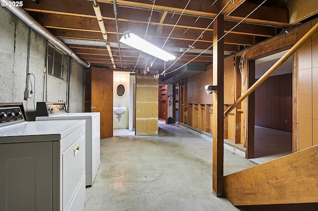 unfinished basement featuring washer and clothes dryer