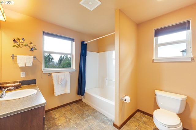 bathroom with toilet, shower / bath combination with curtain, a wealth of natural light, and vanity