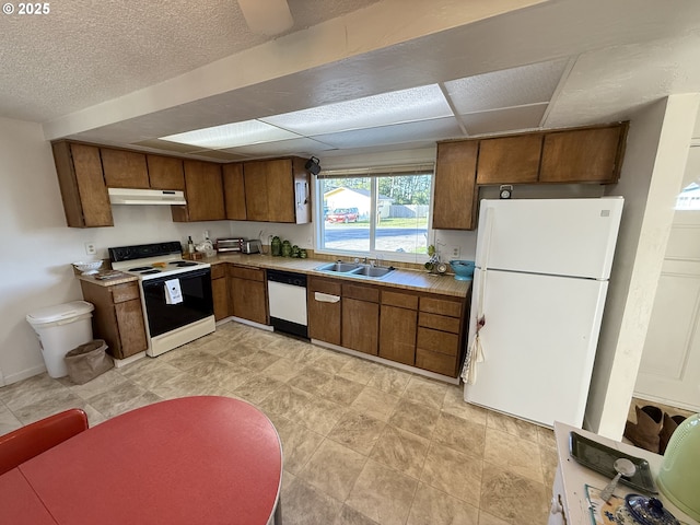 kitchen featuring sink and white appliances