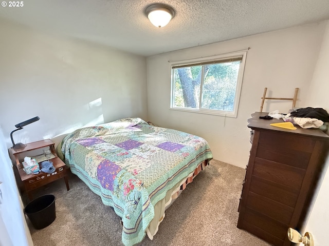 carpeted bedroom with a textured ceiling