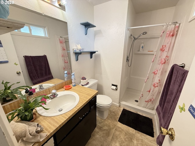 bathroom featuring toilet, a shower with curtain, and vanity